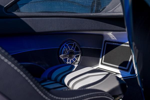 Slide: The Image of Interior of 2025 MTI 440X boat with stylish seating and speaker system. - 13