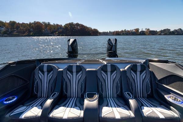 Slide: The Image of Luxury seating on the 2025 MTI 440X boat with scenic lake view. - 17