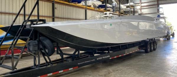 Slide: The Image of 2016 MTI 52' Pleasure boat on a trailer in a storage facility. - 2
