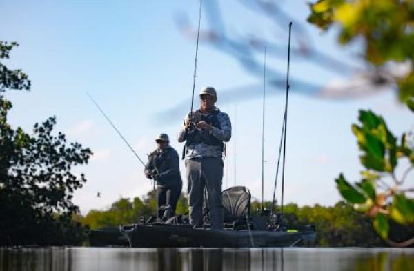 Slide: The Image of Two anglers fishing on a 2023 Native Watercraft SLAYER PROPEL 10 MAX kayak. - 7