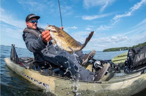 Slide: The Image of Man fishing from a 2023 Native Watercraft Titan Propel 12 kayak, holding a large fish. - 6