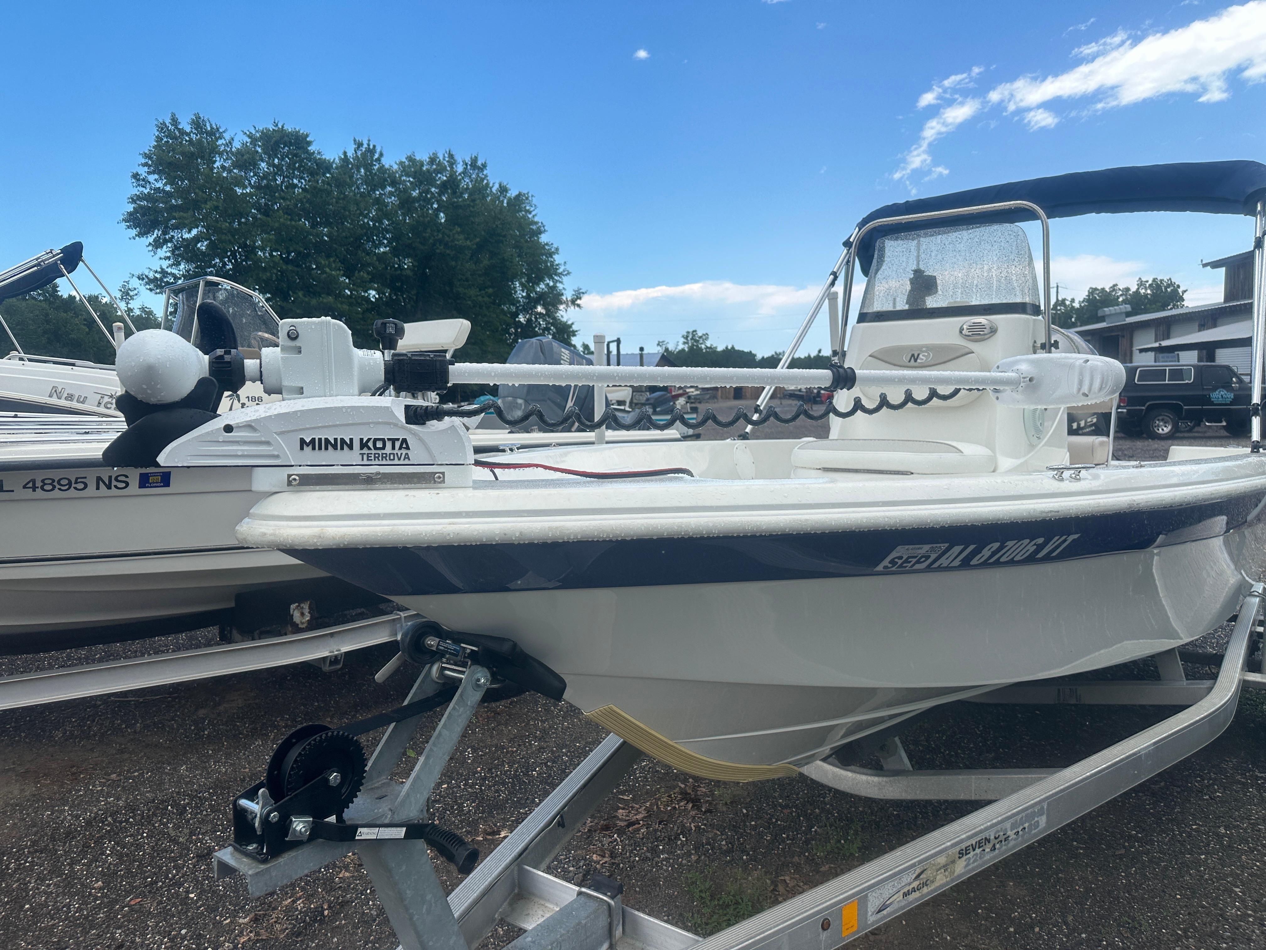Slide: The Image of 2015 NauticStar 1810 NauticBay boat with Minn Kota Terrova motor on trailer. - 1