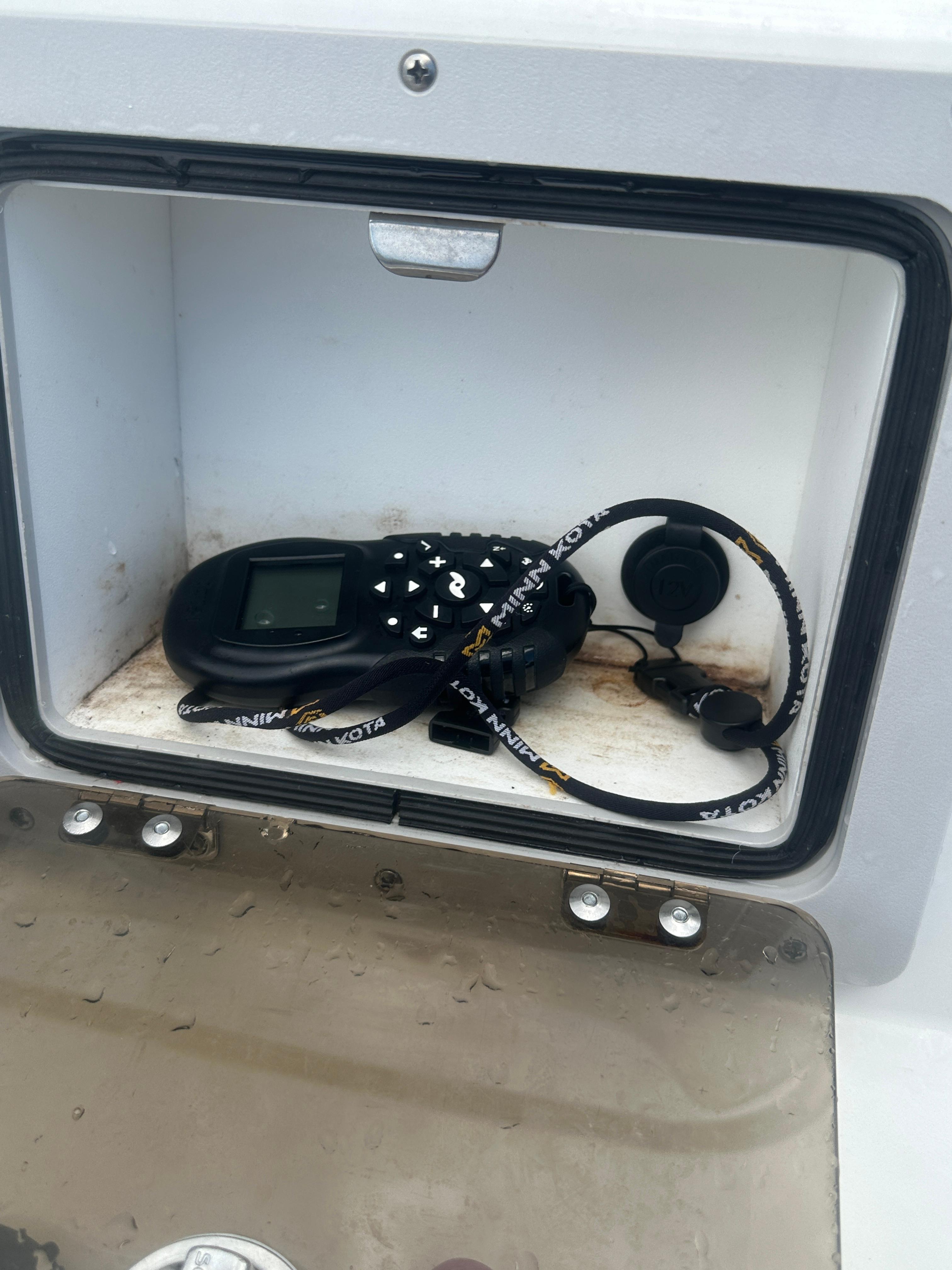 Slide: The Image of Storage compartment on 2015 NauticStar 1810 NauticBay boat with electronic device inside. - 22