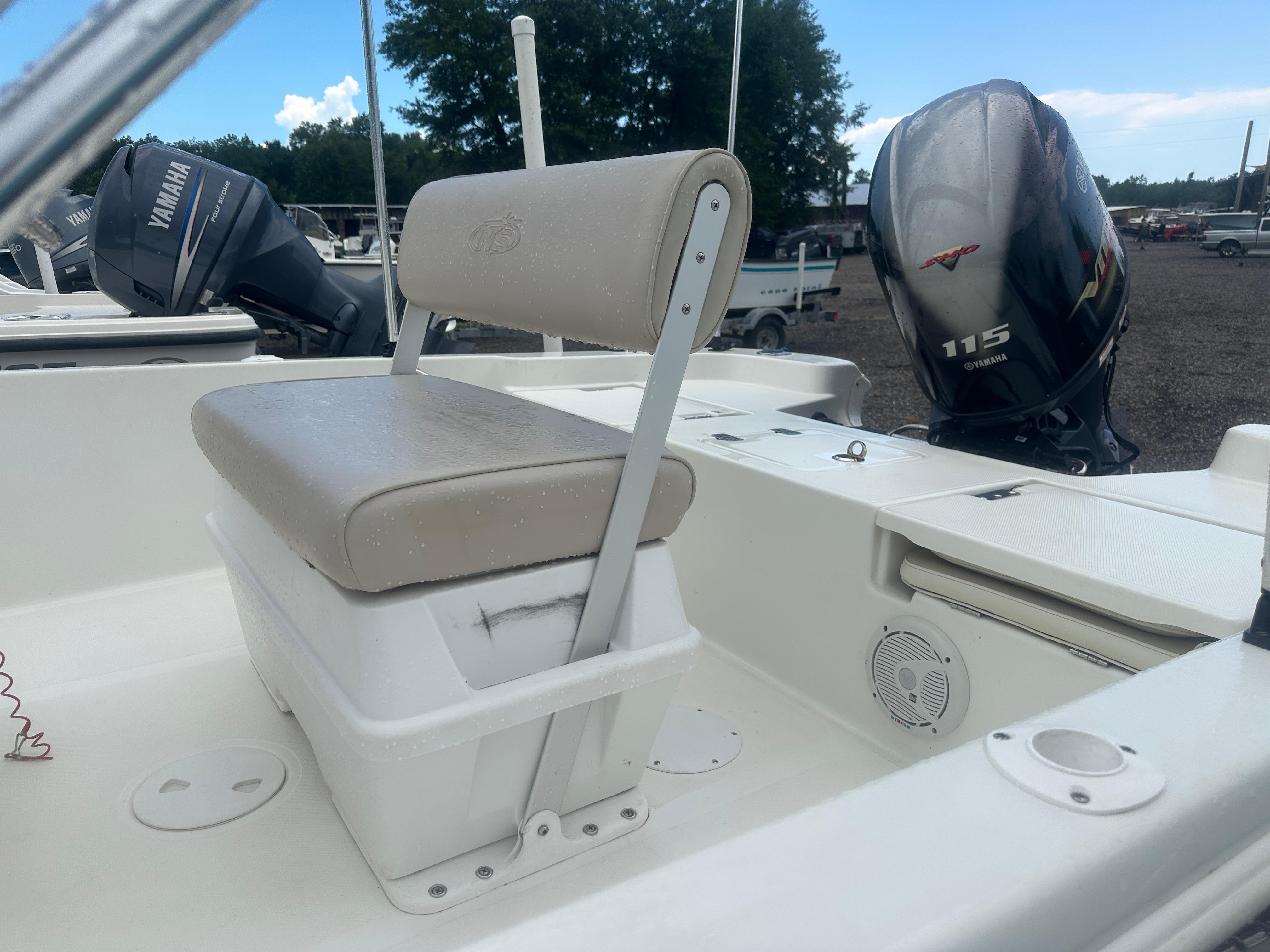 Slide: The Image of 2015 NauticStar 1810 NauticBay boat with Yamaha 115 engine, featuring cushioned seating. - 3
