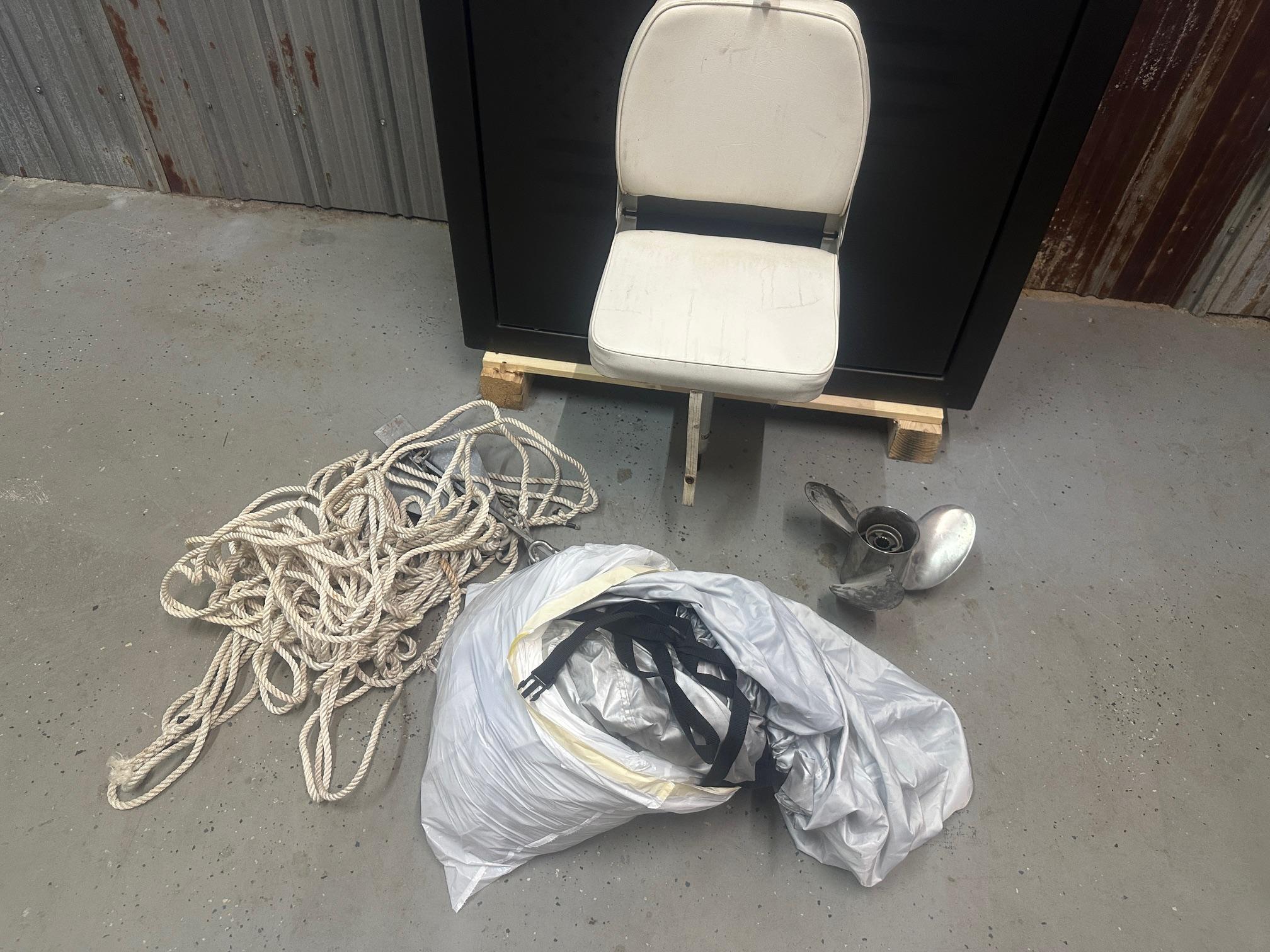 Slide: The Image of Boat accessories including a chair, rope, and propeller for 2015 NauticStar 1810 NauticBay. - 30