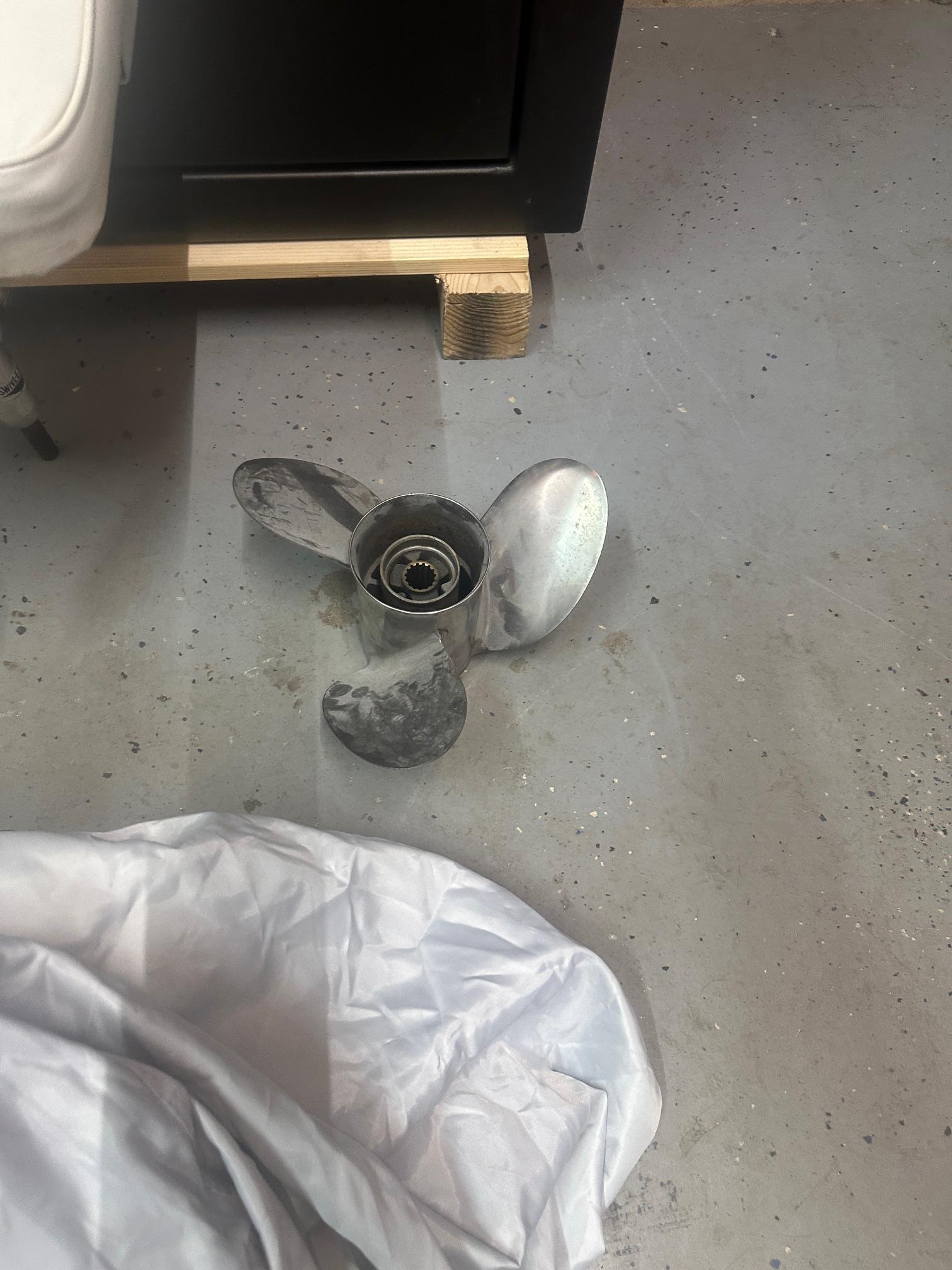 Slide: The Image of Propeller from 2015 NauticStar 1810 NauticBay on concrete floor. - 31