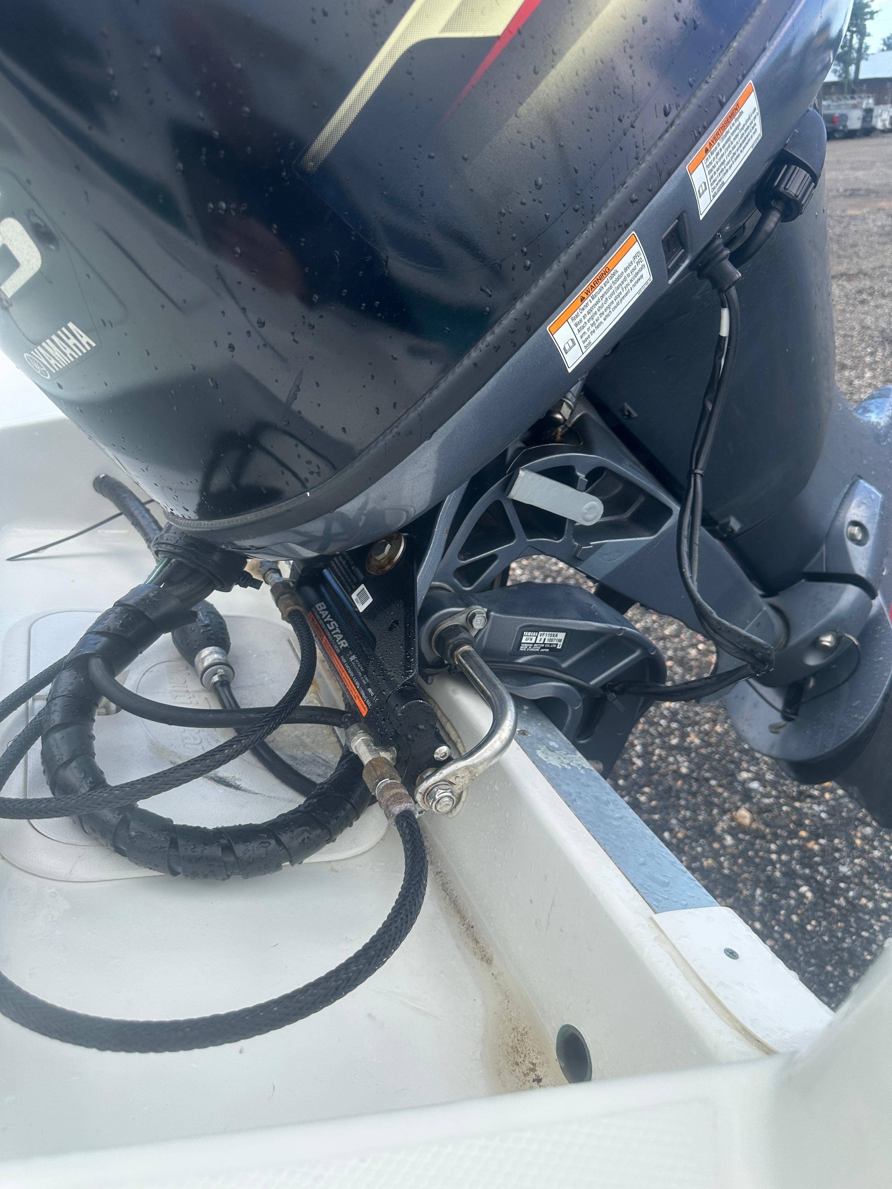 Slide: The Image of Close-up of a 2015 NauticStar 1810 NauticBay boat engine and hydraulic system. - 5