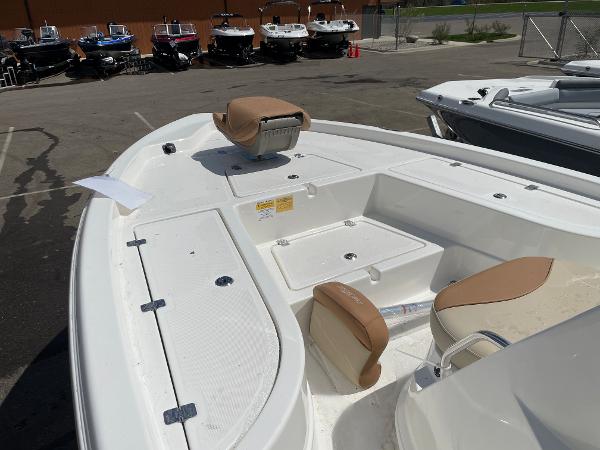 Slide: The Image of 2023 NauticStar 215 XTS boat interior with seating and storage compartments. - 7