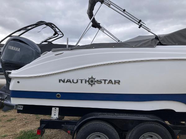 Slide: The Image of 2024 NauticStar 223 DC boat on trailer with Yamaha outboard motor. - 4