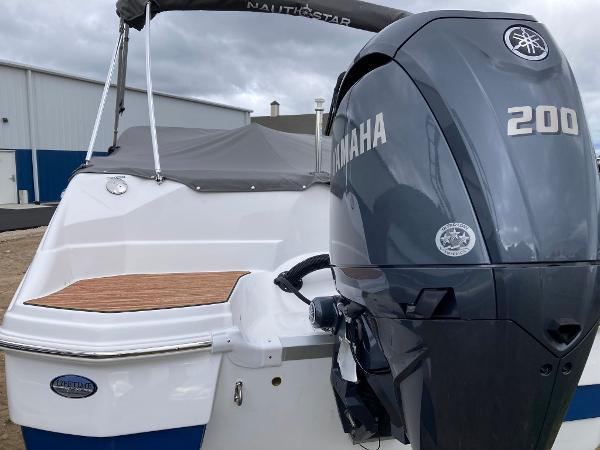 Slide: The Image of 2024 NauticStar 223 DC boat with Yamaha 200 engine, rear view. - 6