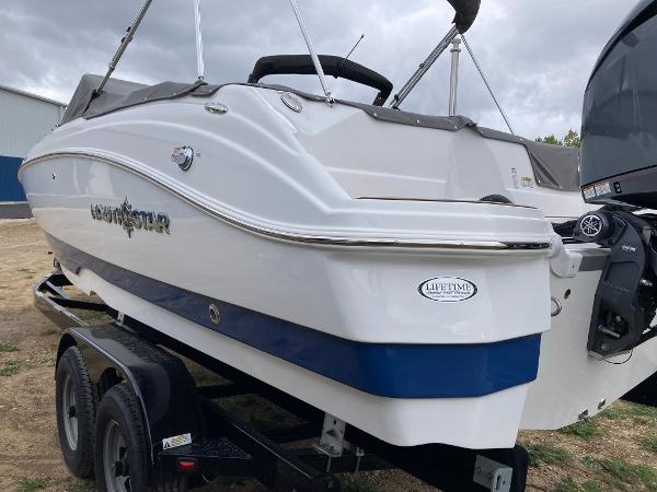 Slide: The Image of 2024 NauticStar 223 DC boat on trailer, rear view. - 8
