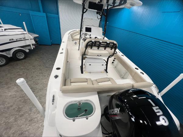 Slide: The Image of 2023 NauticStar 2302 Legacy boat with Mercury 150 engine in showroom. - 1