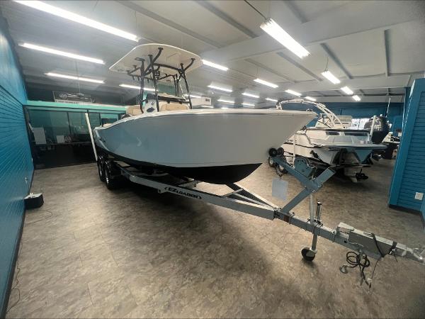 Slide: The Image of 2023 NauticStar 2302 Legacy boat on trailer in showroom. - 5