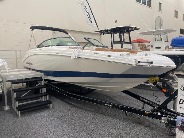 Slide: The Image of 2024 NauticStar 243 DC boat on display in showroom. - 0