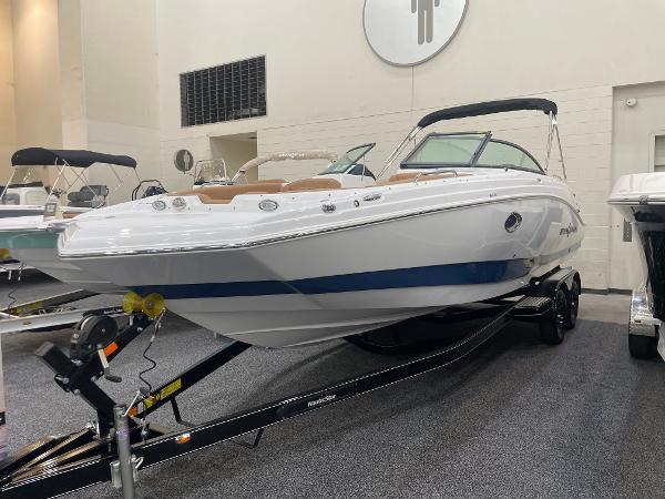 Slide: The Image of 2024 NauticStar 243 DC boat on display in showroom. - 1