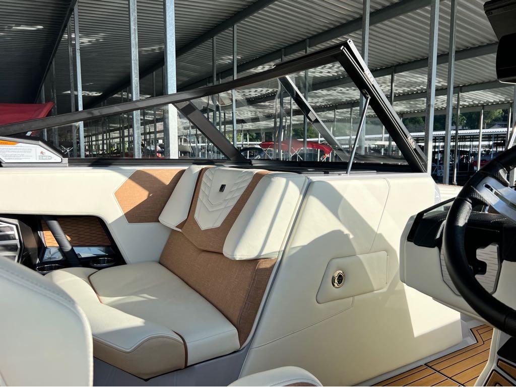 Slide: The Image of 2023 Nautique G23 boat interior with luxurious seating and modern design. - 6