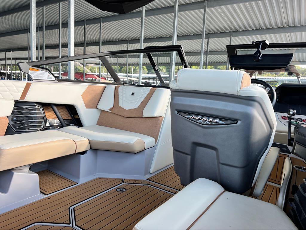 Slide: The Image of Interior of a 2023 Nautique G23 boat with luxurious seating and modern design. - 8