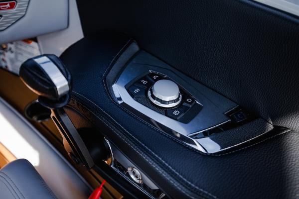 Slide: The Image of Control panel of a 2022 Nautique G25 boat with sleek design and modern features. - 21