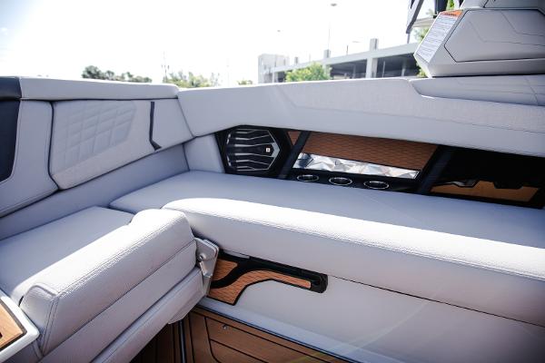 Slide: The Image of 2022 Nautique G25 boat interior with luxurious seating and modern design. - 23