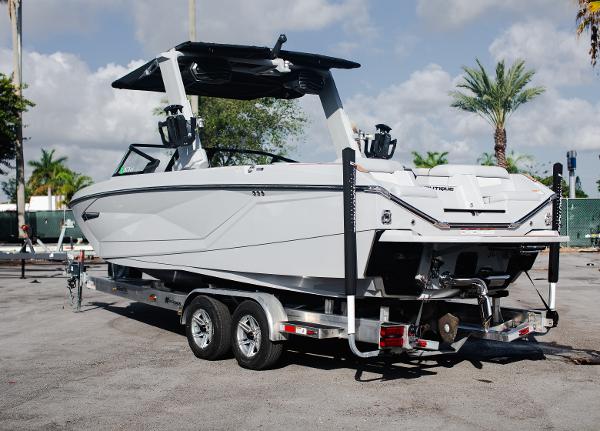 Slide: The Image of 2022 Nautique G25 boat on a trailer, ready for transport. - 4