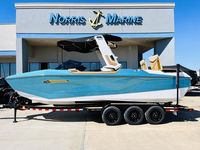 Slide: The Image of 2024 Nautique G25 Paragon boat in blue at Norris Marine dealership. - 1