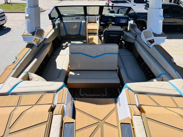Slide: The Image of 2024 Nautique G25 Paragon boat interior with luxurious seating and modern design. - 30