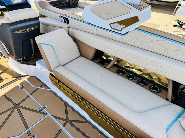 Slide: The Image of 2024 Nautique G25 Paragon boat interior with luxurious seating and modern design. - 33