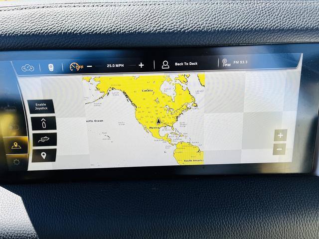 Slide: The Image of 2024 Nautique G25 Paragon dashboard displaying navigation map and controls. - 41
