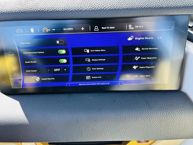 Slide: The Image of 2024 Nautique G25 Paragon dashboard display with various control settings and engine information. - 42
