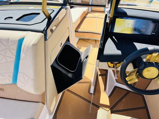 Slide: The Image of 2024 Nautique G25 Paragon interior with modern dashboard and luxurious seating. - 44