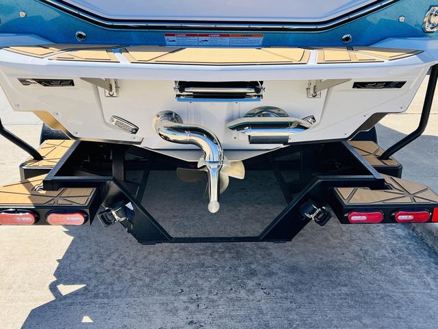 Slide: The Image of 2024 Nautique G25 Paragon boat stern with propeller and swim platform. - 8