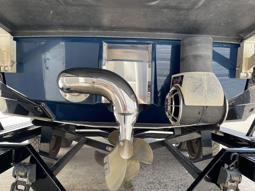 Slide: The Image of 2019 Nautique Super Air Nautique G23 boat propeller and exhaust system. - 2