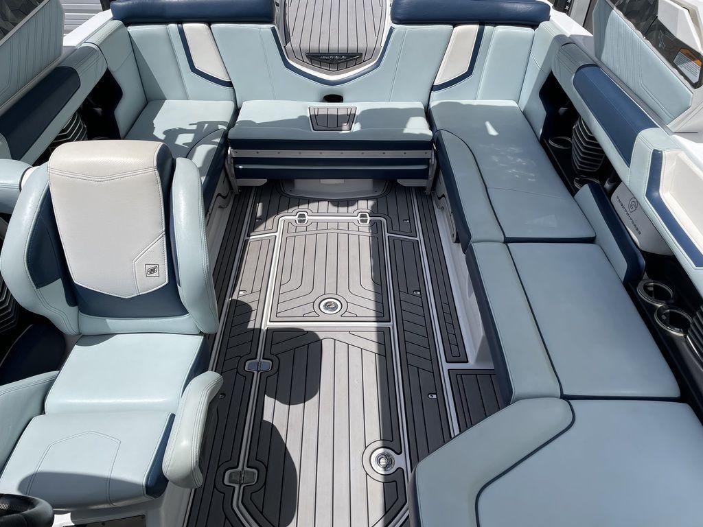 Slide: The Image of 2019 Nautique Super Air Nautique G23 interior with spacious seating and modern design. - 6
