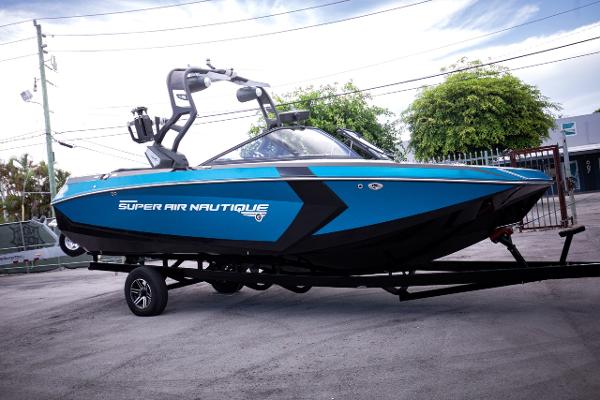 Slide: The Image of 2018 Nautique Super Air Nautique G23 Coastal Edition boat on trailer. - 1