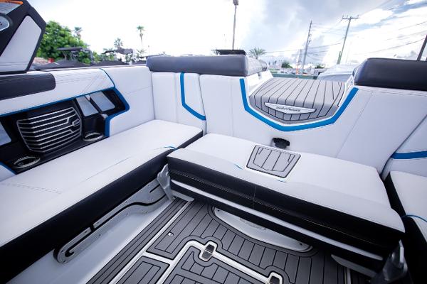 Slide: The Image of 2018 Nautique Super Air Nautique G23 Coastal Edition interior seating area. - 10
