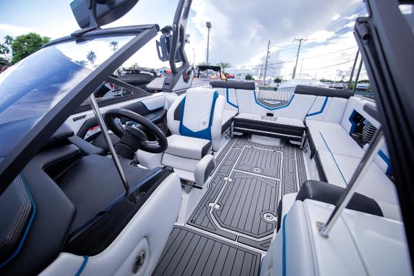 Slide: The Image of 2018 Nautique Super Air Nautique G23 Coastal Edition interior with modern seating and steering. - 13