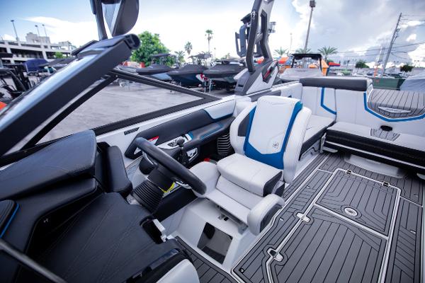 Slide: The Image of 2018 Nautique Super Air Nautique G23 Coastal Edition interior with modern seating and controls. - 17