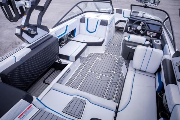 Slide: The Image of 2018 Nautique Super Air Nautique G23 Coastal Edition interior with modern seating and dashboard. - 18