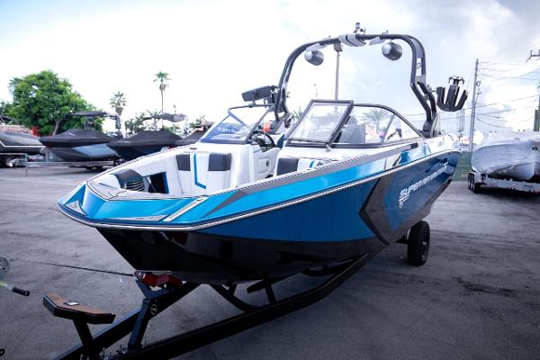 Slide: The Image of 2018 Nautique Super Air Nautique G23 Coastal Edition boat in blue on trailer. - 2