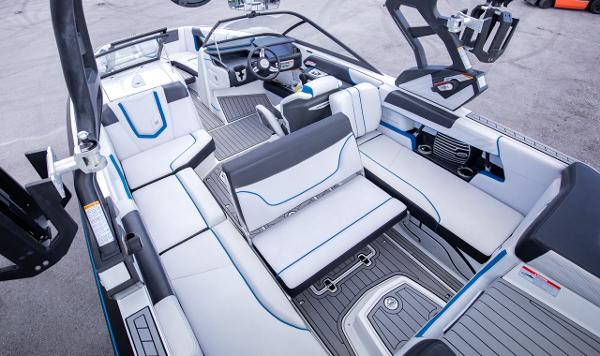 Slide: The Image of 2018 Nautique Super Air Nautique G23 Coastal Edition interior with white and blue seating. - 21