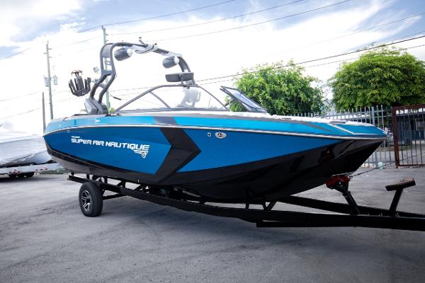 Slide: The Image of 2018 Nautique Super Air Nautique G23 Coastal Edition boat on trailer. - 22