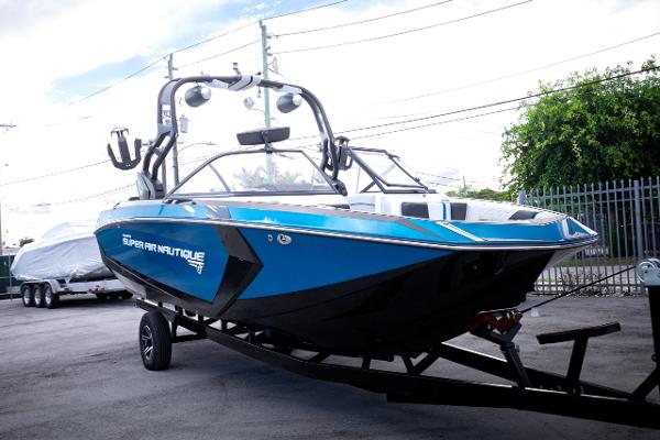 Slide: The Image of 2018 Nautique Super Air Nautique G23 Coastal Edition on trailer, blue and black. - 24