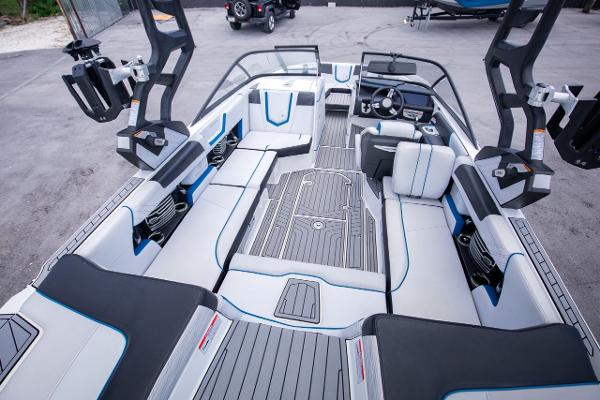Slide: The Image of 2018 Nautique Super Air Nautique G23 Coastal Edition interior, spacious seating, advanced dashboard. - 3