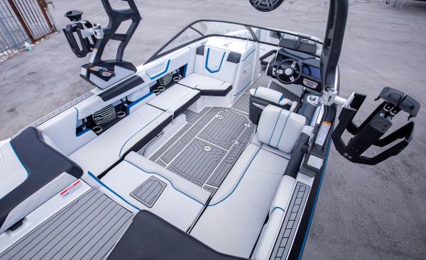 Slide: The Image of 2018 Nautique Super Air Nautique G23 Coastal Edition interior with spacious seating and advanced controls. - 4