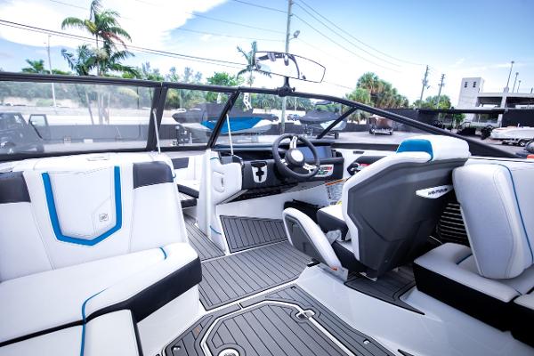 Slide: The Image of 2018 Nautique Super Air Nautique G23 Coastal Edition interior with modern dashboard and seating. - 9