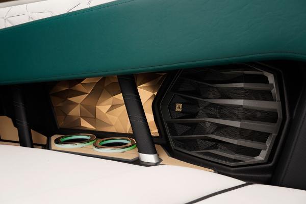 Slide: The Image of 2023 Nautique Super Air Nautique G23 Paragon interior speaker and cup holder detail. - 16