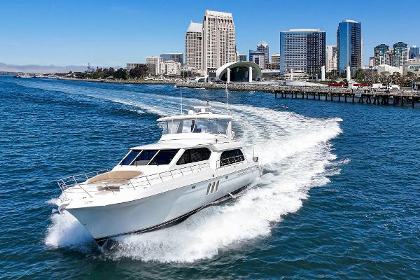 Slide: The Image of 2008 Navigator 62 Pilothouse yacht cruising near city skyline on a sunny day. - 0