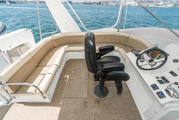 Slide: The Image of 2008 Navigator 62 Pilothouse helm with seating, overlooking ocean view. - 14