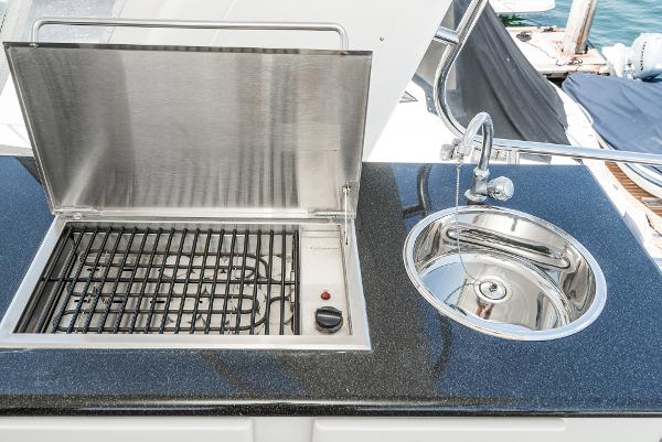 Slide: The Image of Outdoor grill and sink on 2008 Navigator 62 Pilothouse yacht deck. - 17