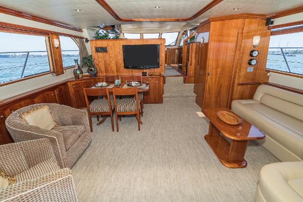 Slide: The Image of Luxurious interior of 2008 Navigator 62 Pilothouse yacht with elegant wood finishes and comfortable seating. - 24